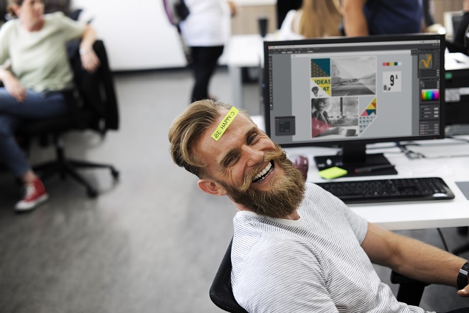 Man Having Be Happy Sticky Note on Forehead During Office Break